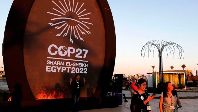 People walk at the green zone of the Sharm el-Sheikh International Convention Centre, during the COP27 climate conference in Egypt's Red Sea resort city of the same name