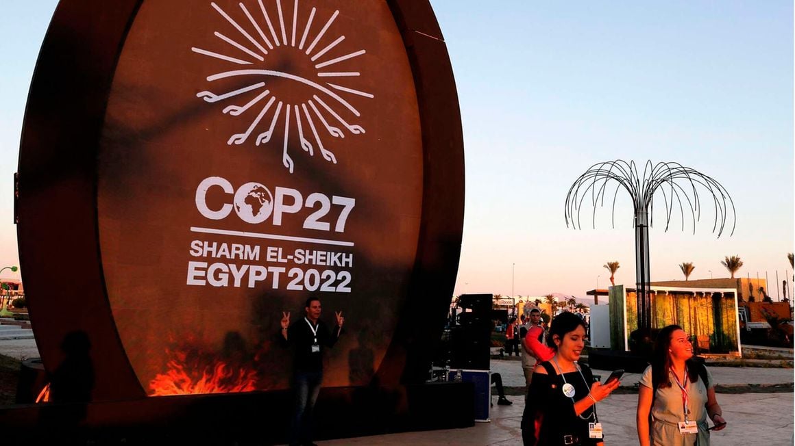 People walk at the green zone of the Sharm el-Sheikh International Convention Centre, during the COP27 climate conference in Egypt's Red Sea resort city of the same name